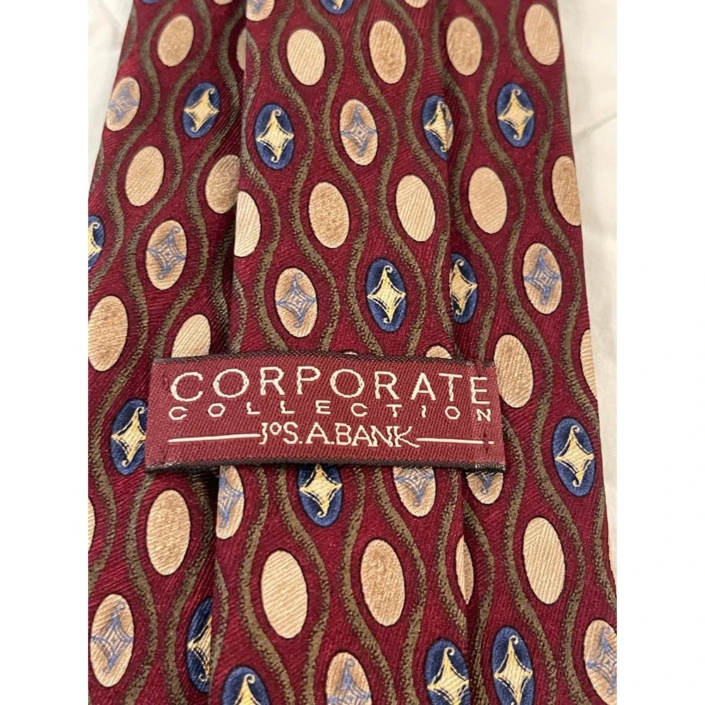 00244-JosA Bank Corporate Collection Silk Tie Burgundy Tan Blue Geometric w/ Box